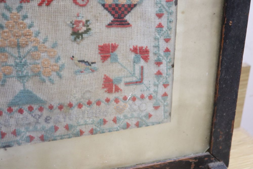 A needlework sampler dated 1886, framed as a firescreen, overall height 71cm